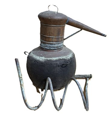 Copper Still
. Conical-shaped body, boiler with wings, helmet with handle on top and coiled 