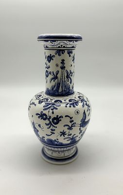 Solitary figure in Portuguese earthenware
. Molded and embossed, marked at the base, bulbous 