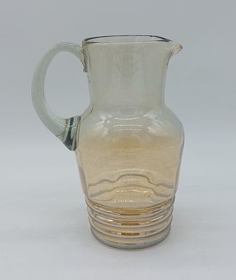 Glass Mug
. Round-shaped body with open handle, chiseled decoration in relief with onion skin 