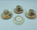 Three porcelain cups and saucers
. Three cups and four saucers in porcelain. Polychrome Image - 1