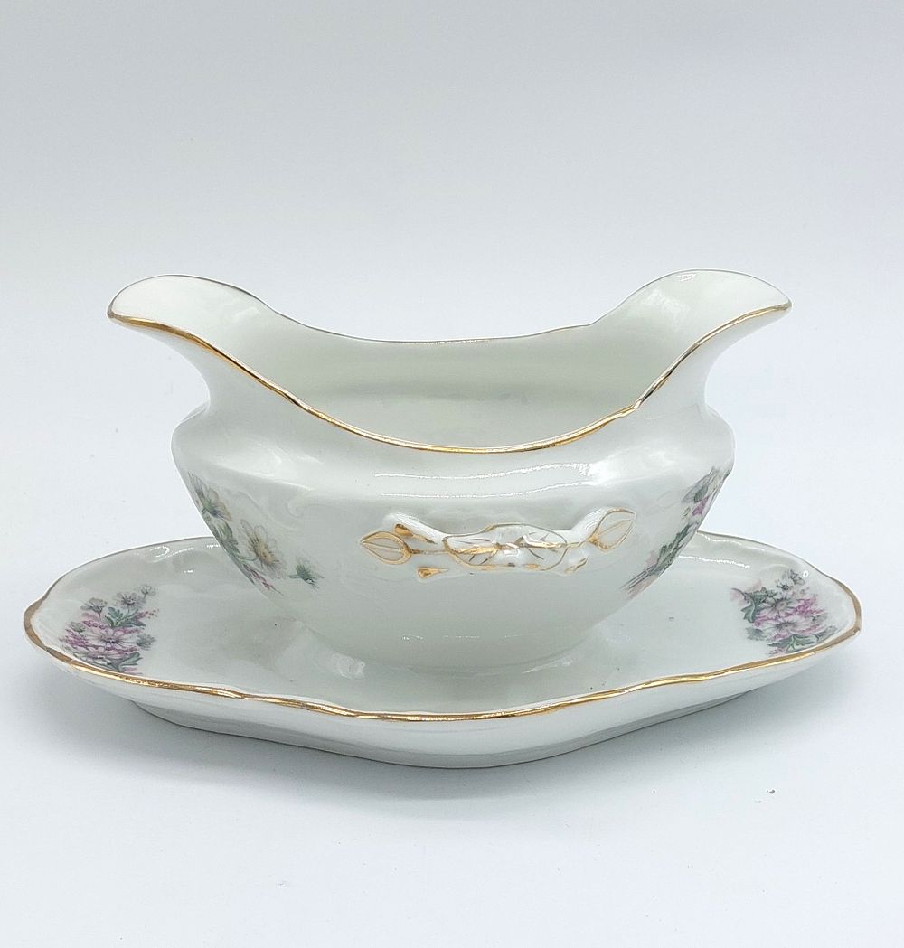 Sauce Boat in Portuguese Porcelain
. Molded and embossed, unmarked, gravy boat and presenter 