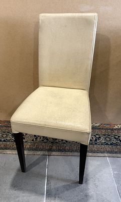 Leather Chair
. Wooden frame, black finished legs, leather upholstery on the back and seat with 