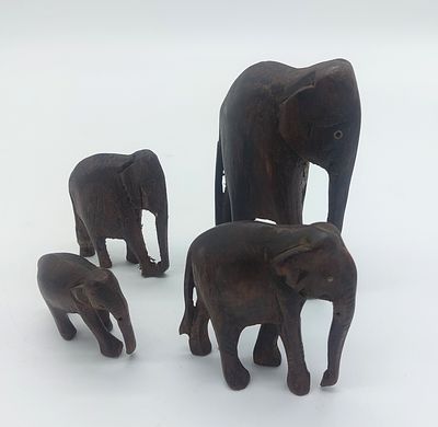 Four Wooden Sculptures
. Bodies made of exotic wood, representing elephants, are folk art pieces 