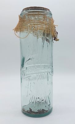 Glass bottle
. Cylindrical body with cork lid, featuring embossed chiseled decoration, Spaghetti 