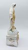 Sculpture in Porcelain. Representing Saint Mary, gold decoration on a white background supported Image - 1