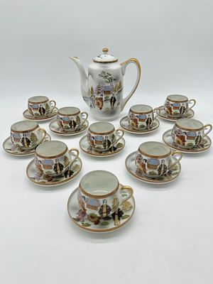 Oriental Porcelain Coffee Service
. Molded and relief, marked on the base, teapot and ten cups 