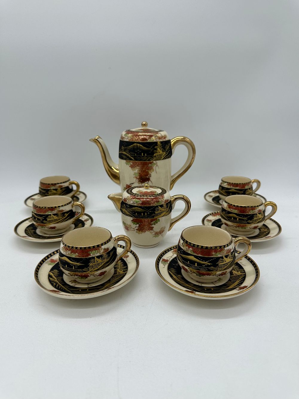 Oriental Porcelain Coffee Service
. Molded and relief, marked on the base, teapot, sugar bowl 