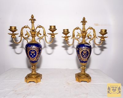 Pair of porcelain candlesticks. With two lights (Probably Manufactured by Sevres) with gilt 