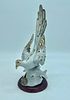 porcelain statue. White porcelain statue depicting a bird. The piece is decorated with small Image - 1