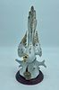 porcelain statue. White porcelain statue depicting a bird. The piece is decorated with small Image - 3
