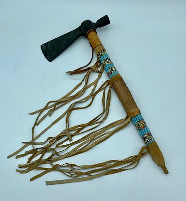 Handicraft piece of tribal axe. Handicraft piece replicating a tribal axe. Wooden body lined 