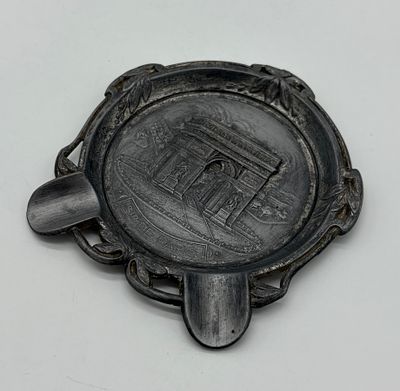 Metal ashtray. Moulded and embossed metal ashtray. Circular-shaped body with relief metal 