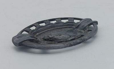 Tin Ashtray
. Oval-shaped body with openwork rim, in the center with an image of a cicada in 