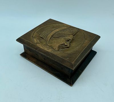 Wooden box. Rectangular wooden box with an embossed image of a woman's profile. The piece 