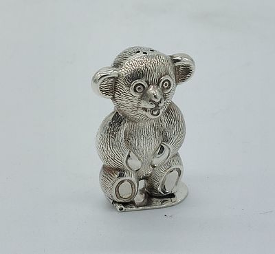 Silver Metal Spice Rack
. Sculpture representing a Bear with a lid on the bottom, with chiseled 