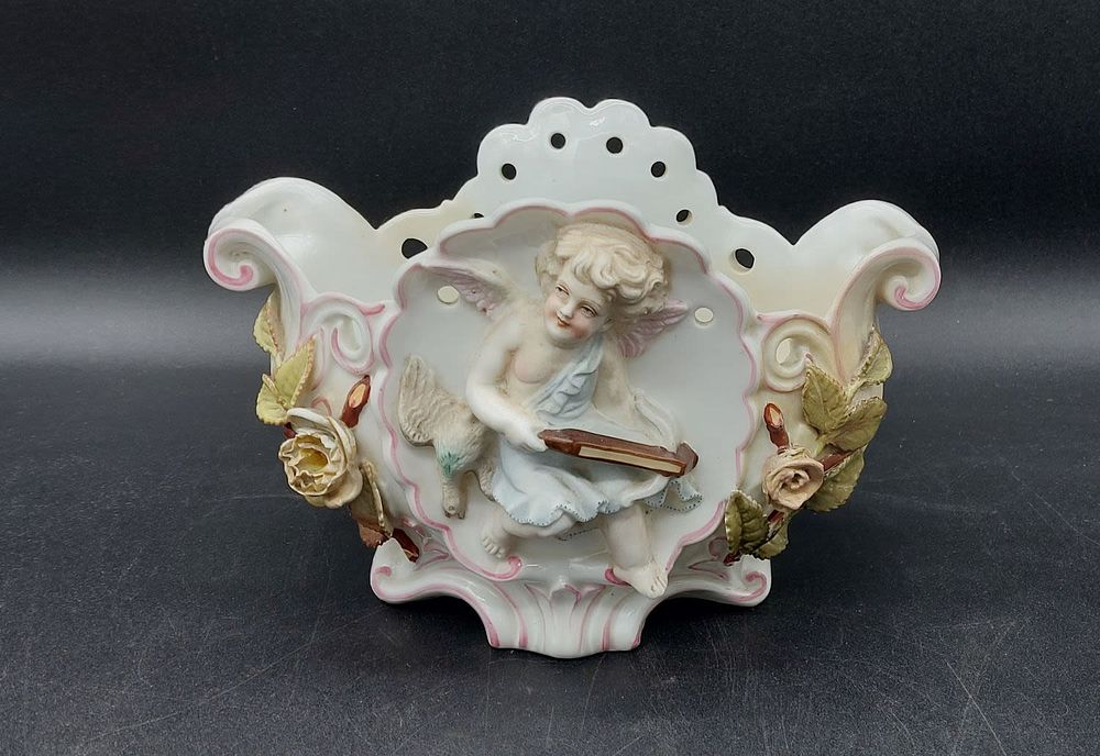 European porcelain flower pot. With scalloped and pierced edge, with floral decoration in high 