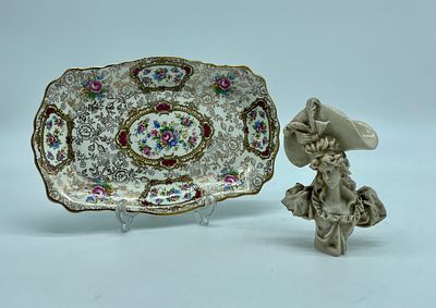 Plate and figurine. Small rectangular plate in English porcelain, polychromed and with worked 