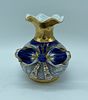 Porcelain vase. Bowl vase with wavy rim and bow sculpture on one side. Painted in shades of Image - 1