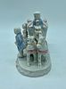 Porcelain sculpture. Moulded and relief porcelain sculpture depicting young people in a Image - 1