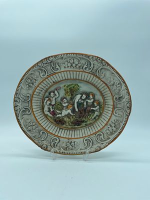 European Earthenware Platter
. Edge bordered in orange fillet, with relief floral decoration, in 