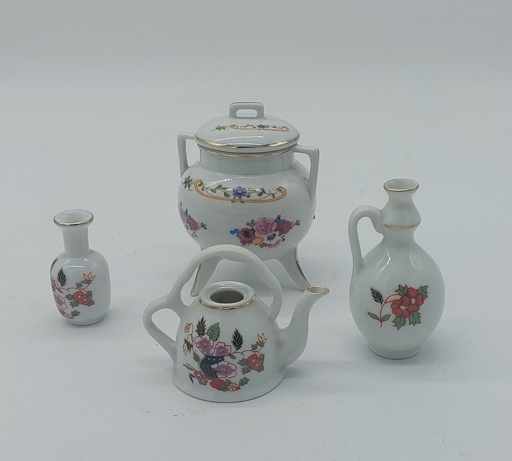 Four Pieces in Portuguese Porcelain
. Molded and embossed, marked on the base, three Porart and 