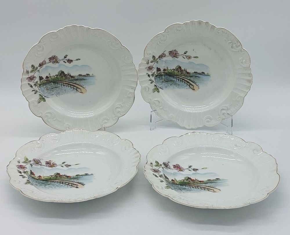 Four Portuguese Porcelain Soup Plates
. Molded and embossed by the Vista Alegre factory, marked 