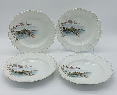 Four Portuguese Porcelain Soup Plates
. Molded and embossed by the Vista Alegre factory, marked 