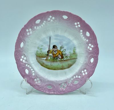 Decorative plate in european porcelain. Cut and hollowed rim with reliefs. Illustration on a 