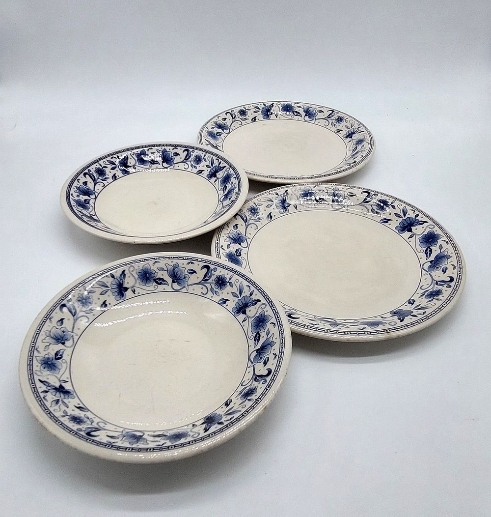 Four Earthenware Plates
. Marked on the base, two soup plates and two side plates, with blue 