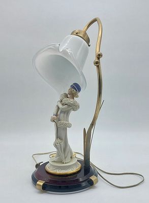 Table Lamp
. The lamp features a porcelain-sculpted base depicting a standing female figure 