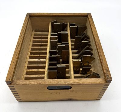 Box with Alphabet for Gravograph
. Wooden box with marked dividers for a metal alphabet for 