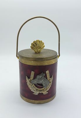 Ice bucket
. Cylindrical metal body with a lid topped with a gold pommel, gold metal handle 