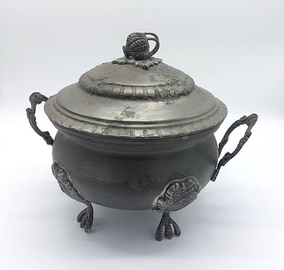 Tin Tureen
. Round body with a lid supported by four claw-shaped feet with double openwork side 