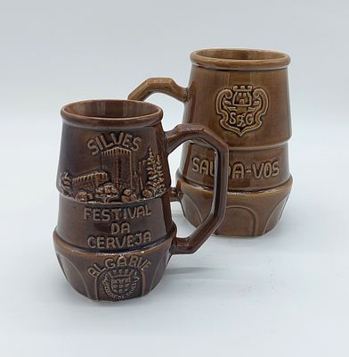 Two earthenware mugs
. Cylindrical bodies with openwork side handles, from the Silves Beer 