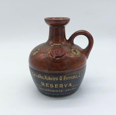 Bottle in Portuguese earthenware
. Marked on the base: Alfe Portugal, bulbous body with openwork 