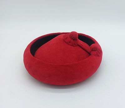 Spanish Cala&ntilde;es Hat
. Round body with flaps that turn the ends up, covered in red velvet with 
