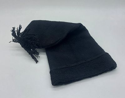Fisherman's Cap
. Cylindrical body with a pompom on top, showing slight signs of use, as seen in 