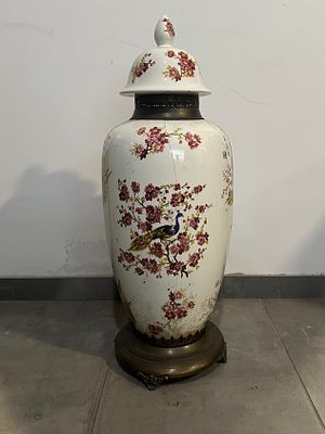 Chinese Porcelain Vase
. Molded and embossed, marked, body in a bulging shape with base and 