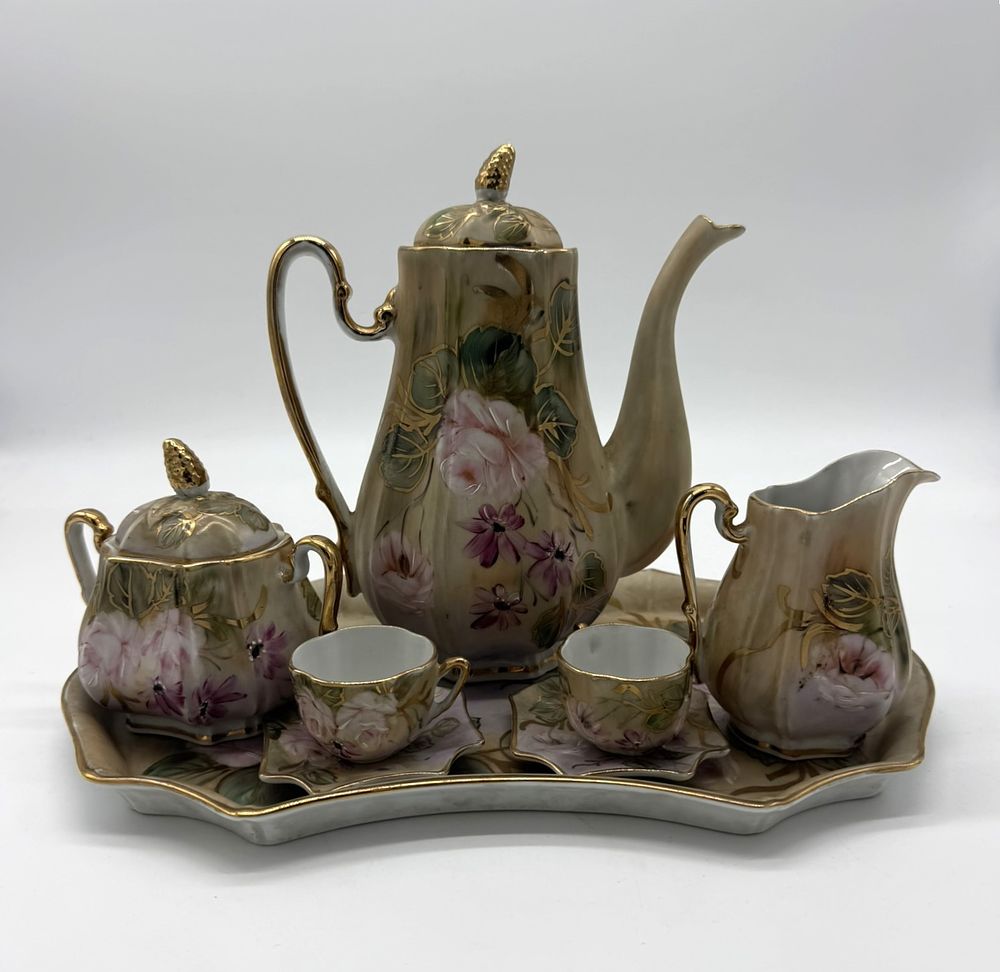 Tete a Tete with Porcelain Tray
. (Tray, two cups, teapot, milk jug and sugar bowl). Molded and 