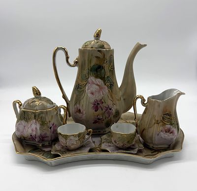 Tete a Tete with Porcelain Tray
. (Tray, two cups, teapot, milk jug and sugar bowl). Molded and 