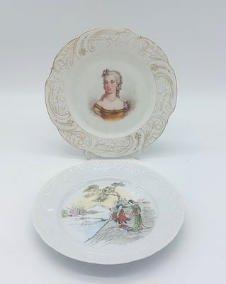 Two European Porcelain Plates
. Molded and embossed, marked at the base, scalloped edges, with 