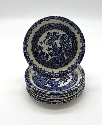 Six English Earthenware Plates. Round-shaped bodies with blue decoration on a glazed white 