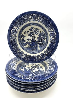 Seven English Faience Soup Plates
. Round-bodied vessels, marked on the base, featuring blue 