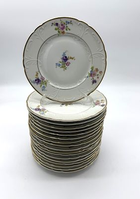 Eighteen Portuguese Porcelain Bread Plates
. Molded and relief-decorated, with a mark on the 