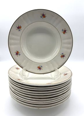 Twelve Portuguese Faience Soup Plates
. Round-bodied pieces with base marks (Sacav&eacute;m); 