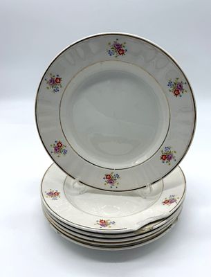 Six Portuguese Faience Plates
. Round-bodied pieces with the Sacav&eacute;m mark on the base, featuring 