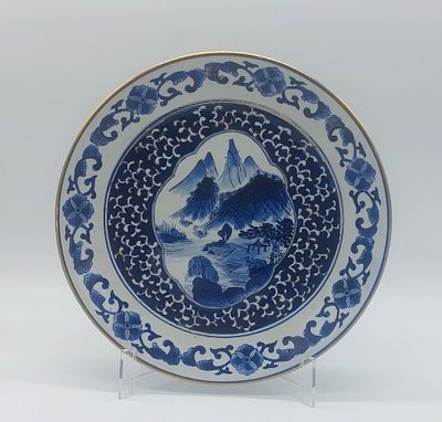 Japanese Porcelain Plate
. Molded and embossed, marked at the base, with a gold-trimmed rim, and 