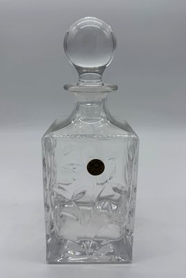RCR Crystal Bottle
. Square-shaped body with a cylindrical stopper, featuring chiseled and 