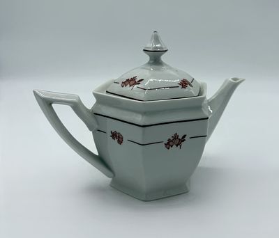 Portuguese Porcelain Teapot
. Molded and embossed, marked on the base, Candal, monochrome floral 