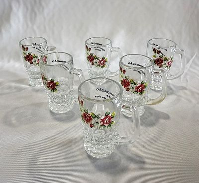 Set of Six Miniature Glass Mugs
. Cylindrical bodies with openwork handles, translucent glass 